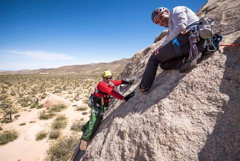 Photo of Saving Special Places keynote speaker, Enock Glidden, rock climbing