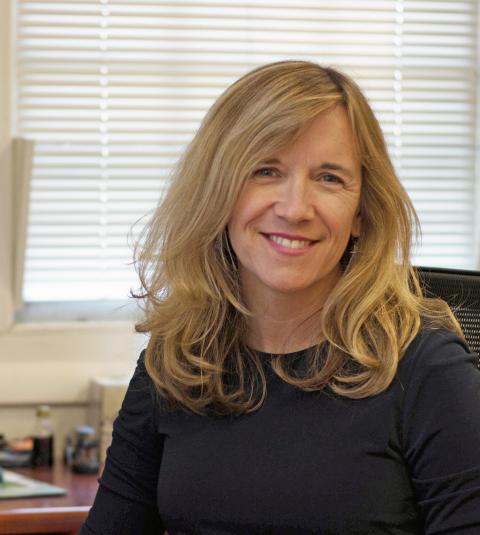 Headshot of Amy Loader in an office