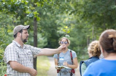 Mike showing an invasive plant