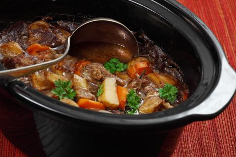 Beef stew in a slow cooker pot.