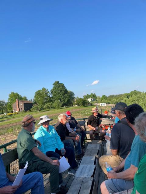 Participants that attended the Kimball Fruit Farm Twilight meeting enjoy a tractor ride through the orchard