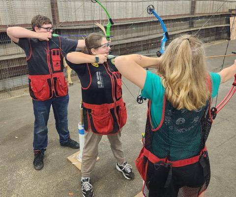 4-H members practicing archery skills