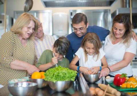 extended family group cooking together