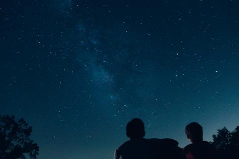 two people gazing at the night sky