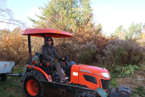 Woman driving tractor