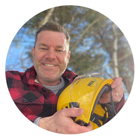 greg holding a forestry helmet