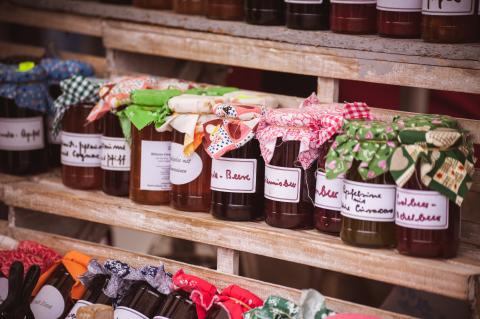 jars of homemade jam with colorful fabrics decorating the lids