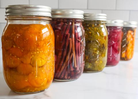 canned and pickled vegetables in canning jars