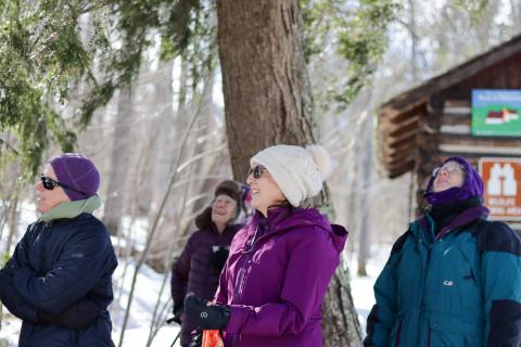 four women standing outside