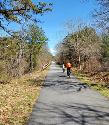 Biking on the WOW Trail in Belmont.