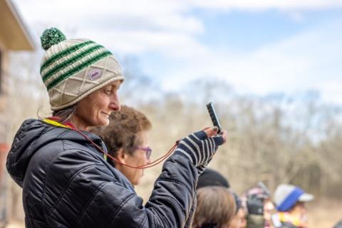 woman holding a compass