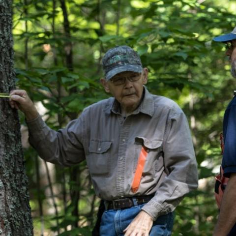 two people in woods