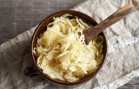 sauerkraut and serving spoon in a bowl