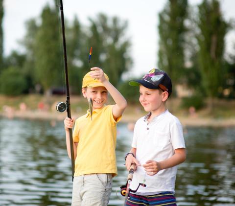 Two boys fishing at a Lake
