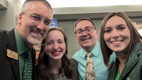 group of adults smiling