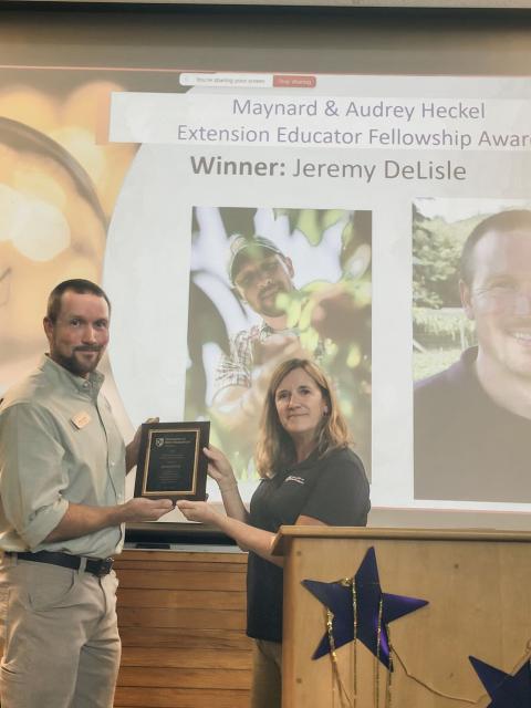 woman and man with award