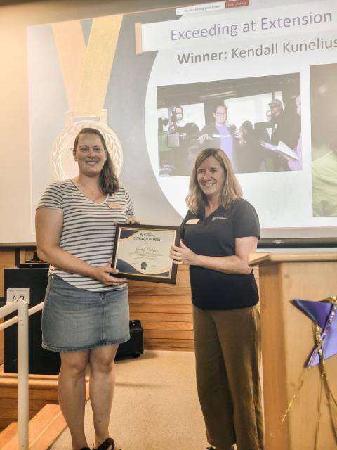 two women with award