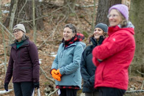 women standing outside smiling