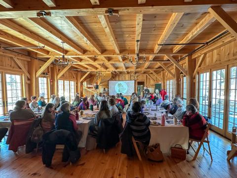 a photo of the participants seated watching a presentation 