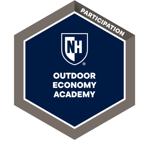 Hexagonal badge graphic representing participation in NH Outdoor Economy Academy, featuring a navy blue center with white text and logo. Outer border is gray with the word "PARTICIPATION" in white along the top edge.