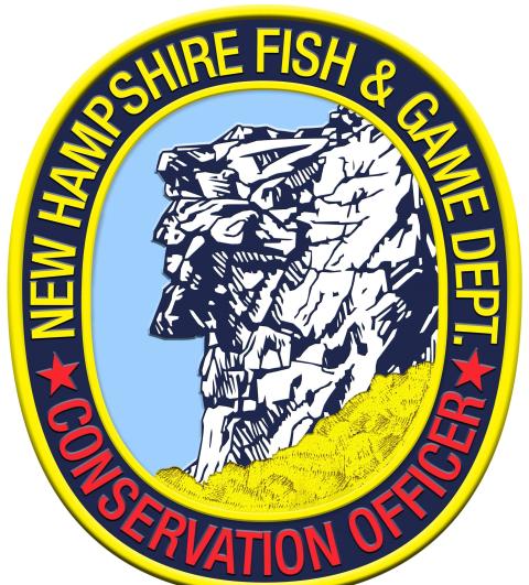 New Hampshire Fish and Game logo looks like a conservation officer badge with text around the perimeter and the center being an illustration of the old man in the mountain geological formation