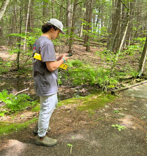 student taking trail measurements