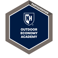UNH Microcredential badge dark blue sheild with "outdoor economy academy" in white letters inside a grey frame