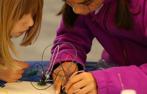 Children working with electronics, part of STEM education