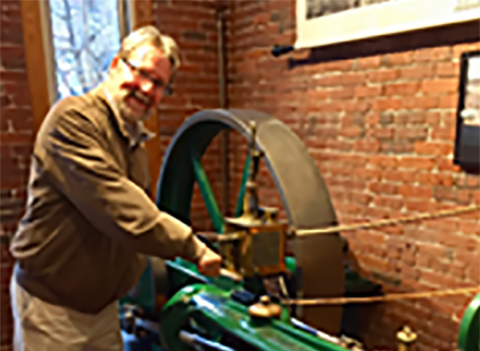 Bill Maddocks showing off a piece of history at Manchester's Millyard