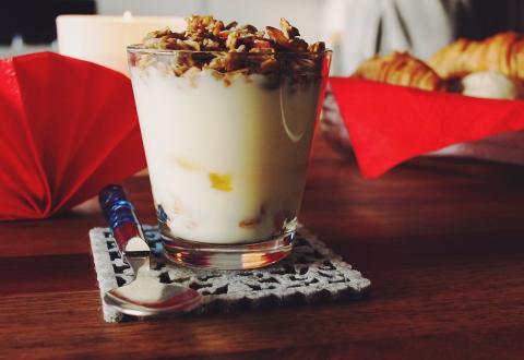 Breakfast banana parfait with spoon.