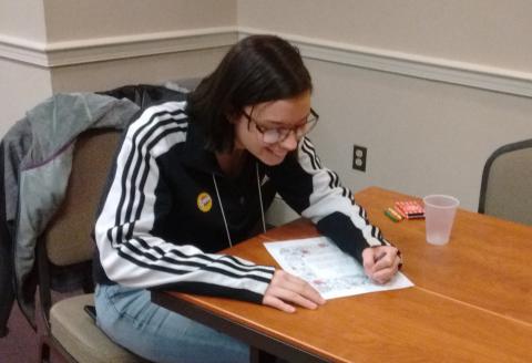 4H youth completes work at desk