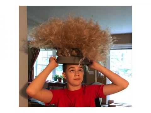 teen with eel mop on head