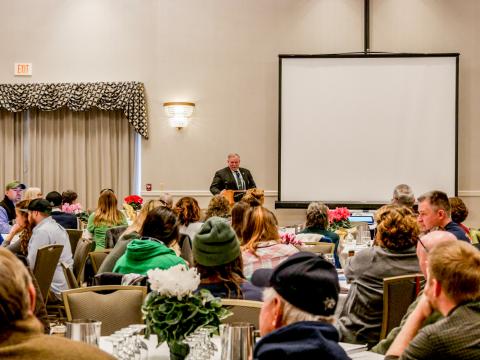 person giving lecture to a crowd