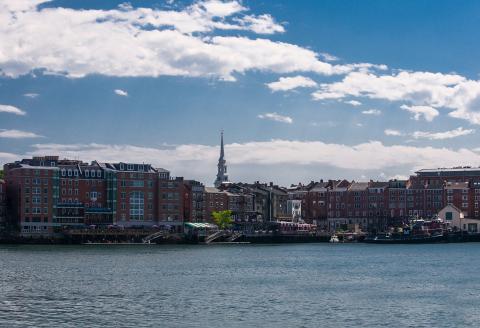 Skyline of Portsmouth buildings in front of the ocean