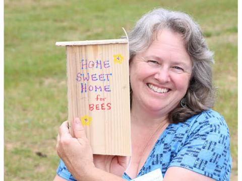 UNH Extension volunteer Kathy Schillemat of Nelson, NH created a special home for bees during the "Make a Bee Box" workshop at the Great Volunteer Getaway.