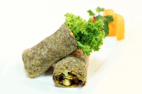 Vegetable wrap sandwich using whole grain wrap.