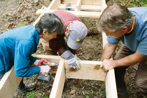 volunteers building bridge