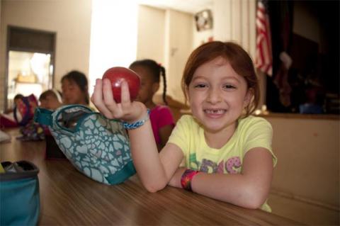 School Lunch girl holding apple