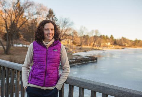 shannon rogers poses on a bridge