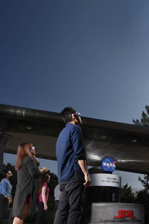 People safely watching a solar eclipse (NASA image)