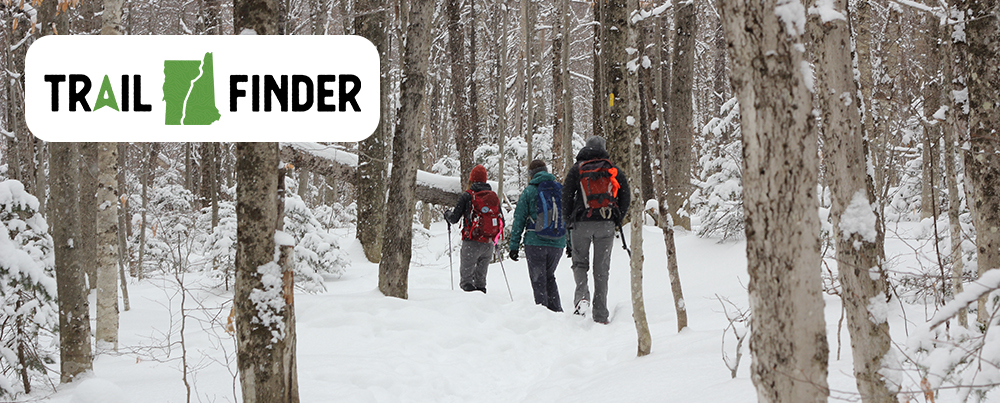 Snowy winter trail with hikers - Trail Finder logo