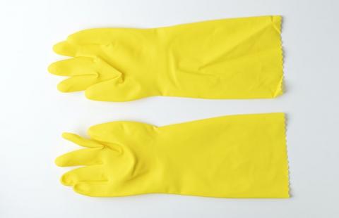 A pair of yellow cleaning gloves
